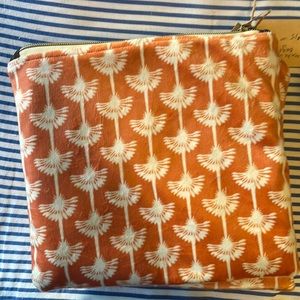 This handmade orange like suede with denim interior bag, dimensions are 9” x 8“.